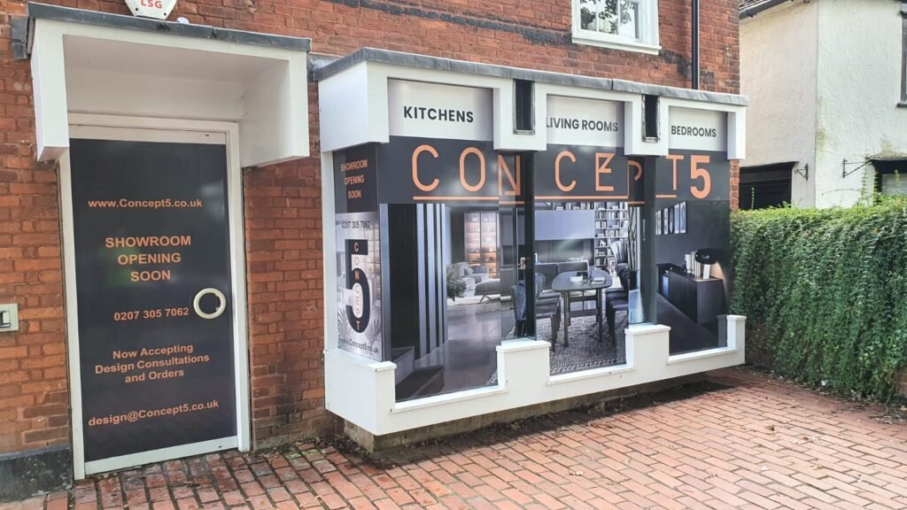 Modern retail storefront with illuminated window display and professional business signage